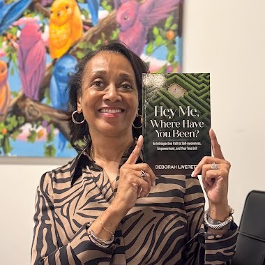 Deborah Liverett holding book