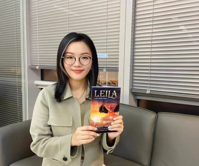 Seshat Press author holding their book