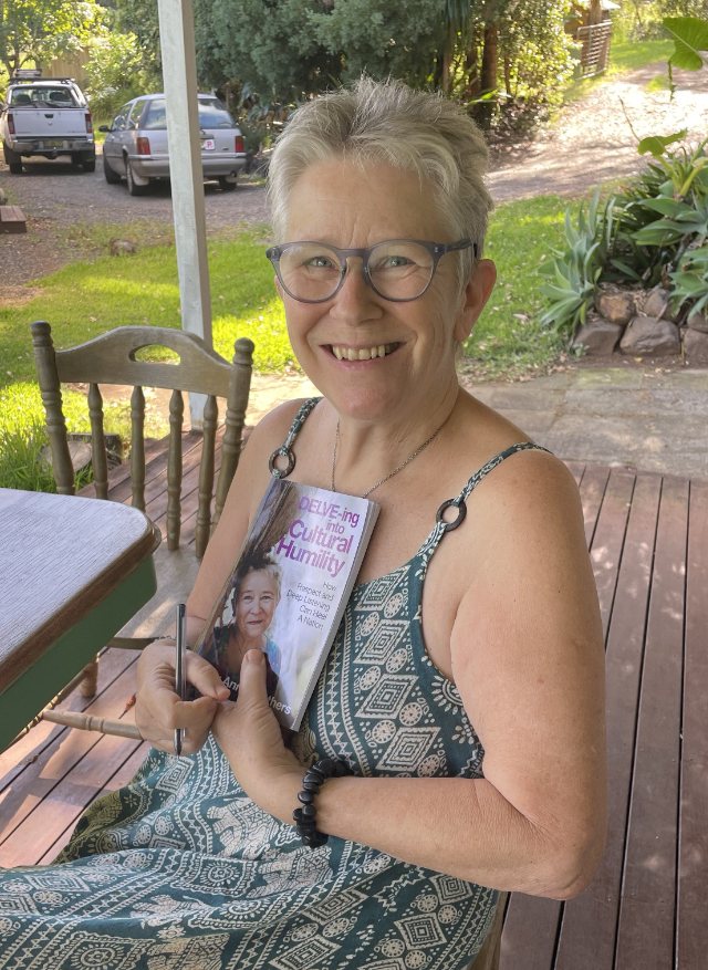Seshat Press author holding their book