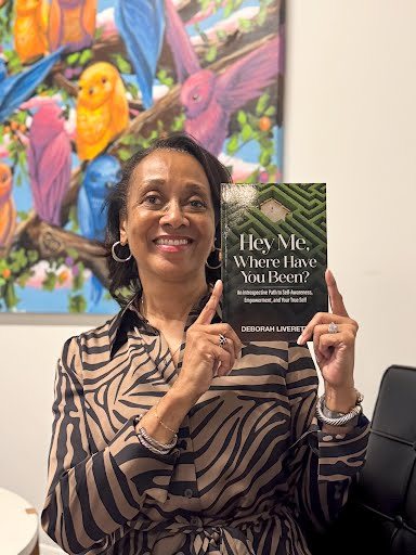 Seshat Press author holding their book