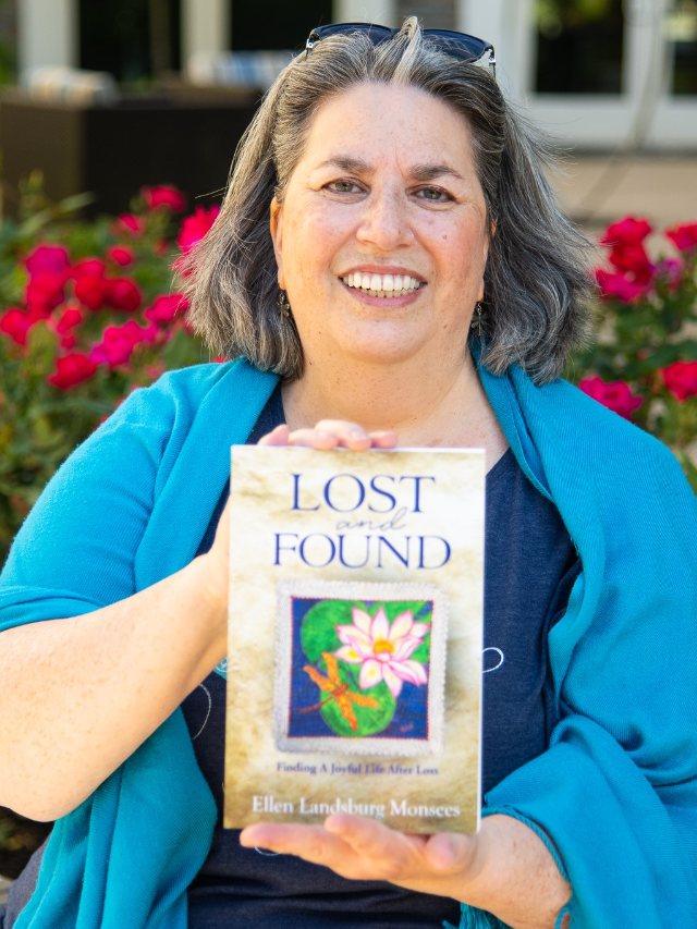 Seshat Press author holding their book