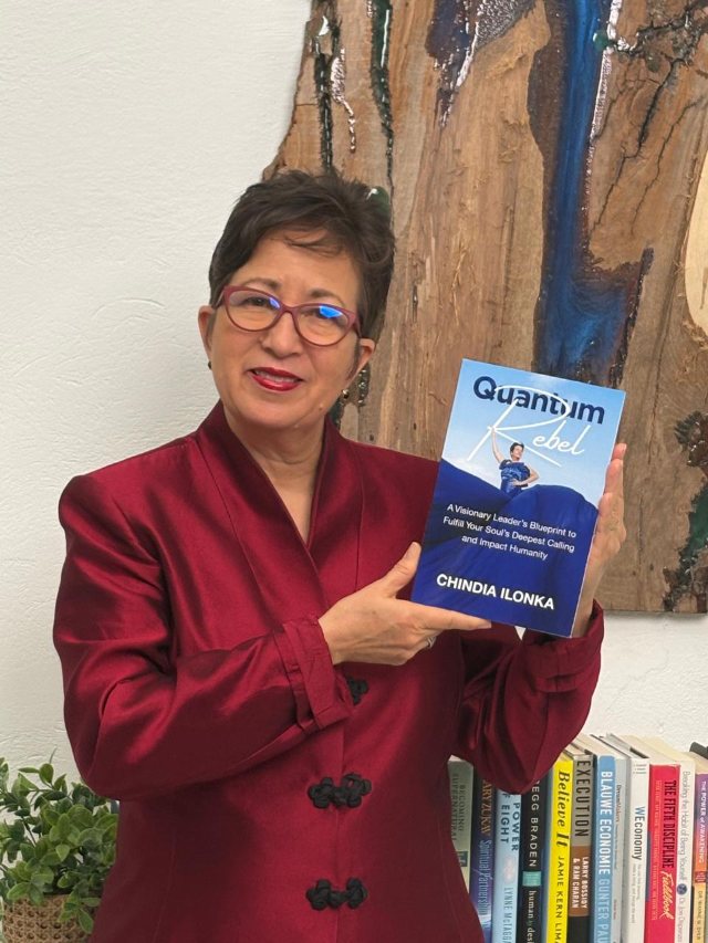 Seshat Press author holding their book