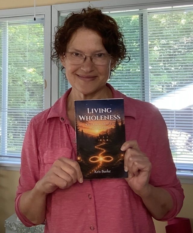 Seshat Press author holding their book
