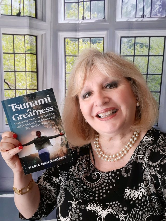 Seshat Press author holding their book