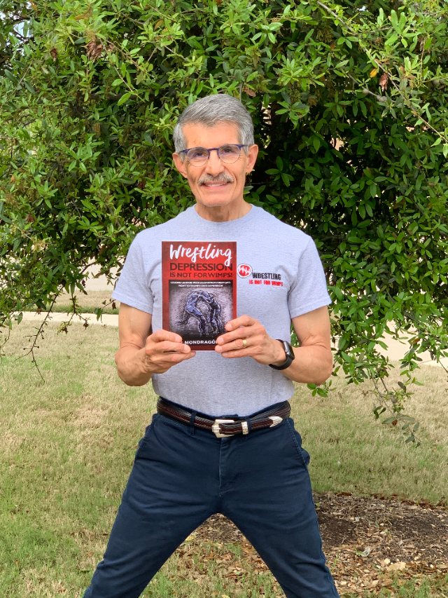 Seshat Press author holding their book